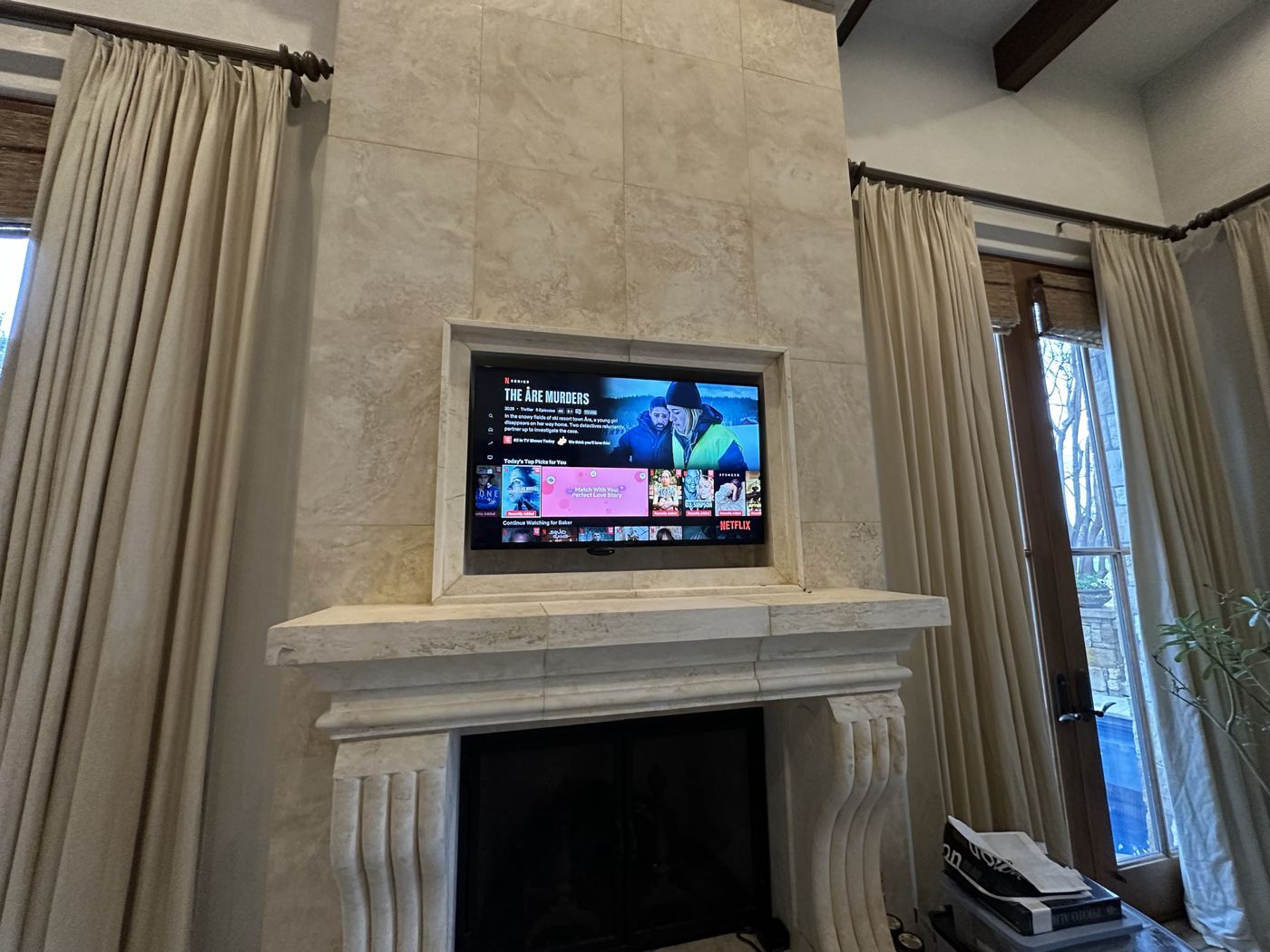 TV set into a tile fireplace niche
